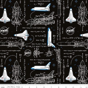 May include: A black and white fabric design featuring a repeating pattern of space shuttles, NASA logos, and equations. The shuttles are drawn in a technical style, with detailed diagrams and labels. The background is a dark blue with white stars.