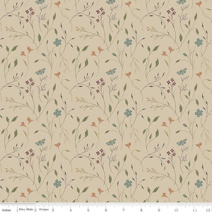 May include: A beige fabric with a repeating floral pattern. The design features delicate stems with small green leaves, clusters of purple buds, and scattered blue and peach-colored flowers. The fabric is marked with the text "Riley Blake Designs".