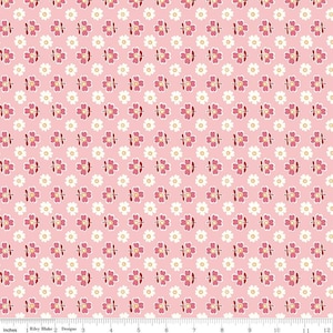 May include: Pink fabric with a repeating pattern of white and pink flowers. The flowers have a white center and a pink outline. The fabric is 12 inches wide.