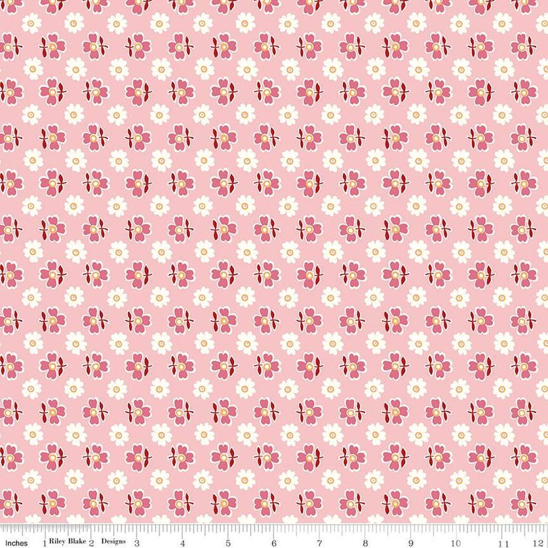 May include: Pink fabric with a repeating pattern of white and pink flowers. The flowers have a white center and a pink outline. The fabric is 12 inches wide.