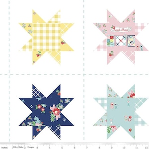 May include: A fabric panel featuring four star-shaped quilt blocks. The blocks showcase various patterns, including gingham, floral prints, and the text "Quilt Show". The color palette includes yellow, pink, blue, and navy, with a white background. The panel is 12 inches wide.