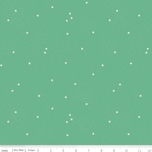 May include: A green fabric with a white polka dot pattern. The dots are small and evenly spaced.