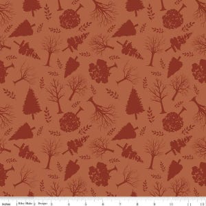 May include: Rust-colored fabric with a repeating pattern of stylized trees and leaves. The design includes various tree silhouettes, such as bare branches, cone-shaped evergreens, and rounded tree forms. The fabric is measured in inches.