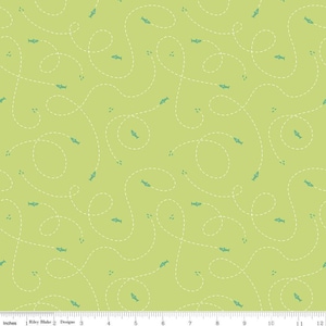 May include: A green fabric with a white dashed line pattern and small blue fish illustrations. The fish are swimming in a random pattern.