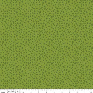 May include: Green fabric with a repeating pattern of small, dark green stars.