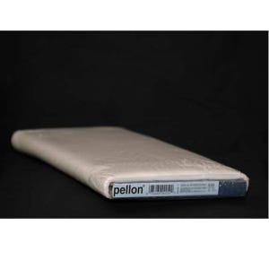 May include: A roll of Pellon fabric, wrapped in clear plastic, against a black background. The fabric is a light beige color. The Pellon label is visible on the end of the roll.