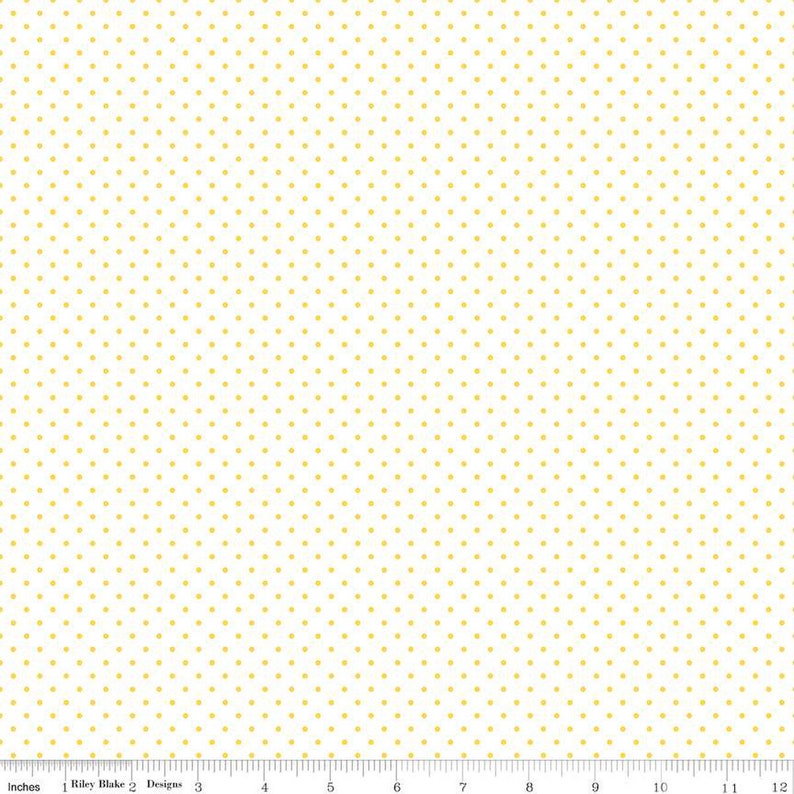 May include: White fabric with a repeating pattern of small yellow dots.