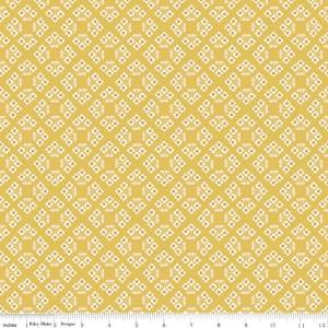 May include: A yellow fabric with a white repeating pattern of small flowers. The fabric has a subtle texture.