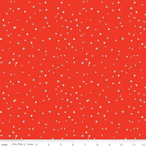 May include: Red fabric with a white and light blue star pattern. The stars are scattered randomly across the fabric.