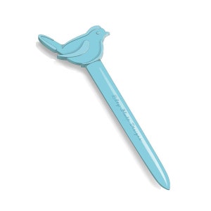 May include: A light blue pen with a bird-shaped top. The pen has the text "Riley Blake Designs" printed on the pen's shaft. The bird is facing right, with its wings and tail slightly extended. The pen is on a white background.