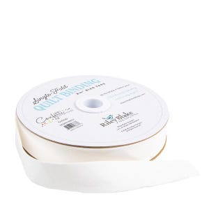 May include: A spool of white single-fold quilt binding tape. The label reads "Single Fold Quilt Binding" and "Confetti" with the Riley Blake Designs logo. The tape is 2.5" wide and made of 100% cotton.