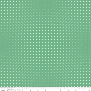 May include: A green fabric with a white polka dot pattern. The fabric is 12 inches wide and is perfect for quilting, crafts, and other sewing projects.