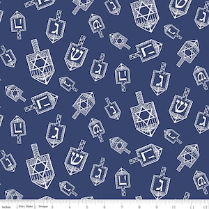 May include: Navy blue fabric with a repeating pattern of white dreidels. The dreidels feature Hebrew letters and Star of David designs, creating a festive and celebratory theme. The fabric is suitable for various craft projects.