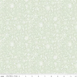 May include: Light green fabric with a white floral pattern. The design features various flowers, leaves, and snowflake-like shapes. The fabric is measured in inches.