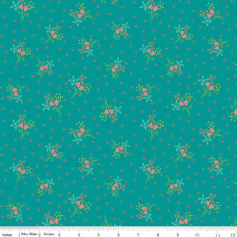 May include: Teal fabric with a repeating pattern of stylized floral bouquets and small red dots. The bouquets feature pink bell-shaped flowers, green leaves, and yellow accents. The fabric is marked with the text "Riley Blake Designs".