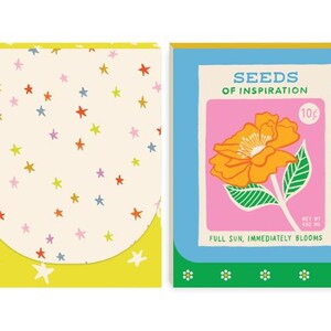 May include: Four colorful notebooks with unique designs. One has a pink background with black and orange stars, another has a cream background with colorful stars, the third features a flower with the text "SEEDS OF INSPIRATION", and the last has two smiling cherries.