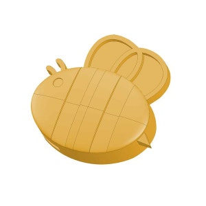 May include: A yellow bee-shaped cookie cutter with a textured surface.