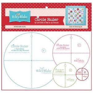 May include: A white circle ruler with blue and green markings. The ruler has three circles with diameters of 9 inches, 6 inches, and 4 inches. The ruler is labeled "Circle Ruler by Lori Holt of Bee in My Bonnet".