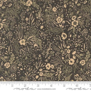 May include: Dark fabric with a floral pattern. The design features beige and cream-colored flowers, leaves, and other botanical elements on a dark background. The fabric has a dense, all-over print with a variety of floral shapes and sizes. The word "moda" is printed at the bottom.