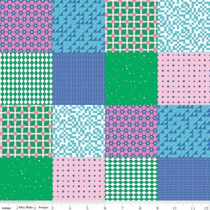 May include: A patchwork fabric featuring 12 different geometric patterns in shades of pink, blue, and green. The fabric is 12 inches wide and includes a ruler for measuring.