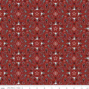 May include: Red fabric with a repeating pattern of white skulls, stars, paisley shapes, and horseshoes. The fabric is designed for quilting and crafting.