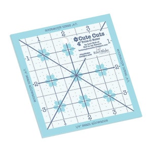 May include: A blue 4-inch trim-it ruler with a grid pattern and flower accents. The ruler is designed for 1/4 inch seam allowance. It is labeled "Cute Cuts" and includes the name "Riley Blake Designs".
