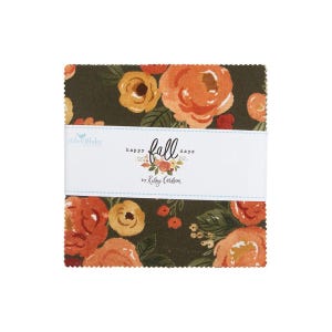 May include: A stack of fabric squares with a floral pattern in shades of orange, yellow, and green on a dark background. A white band across the middle reads "happy fall days" by Kelsey Carlson.