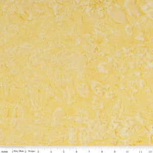 May include: A yellow fabric with a marbled pattern. The fabric has a subtle texture and a light yellow color.