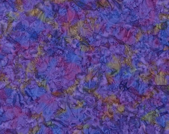 May include: A fabric with a batik design in shades of purple, blue, and yellow. The fabric has a textured appearance with a mottled pattern. The image includes a ruler along the bottom edge, with measurements in inches.