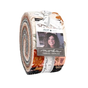 May include: Rolled fabric bundle featuring floral patterns in shades of orange, brown, and cream. The bundle is tied with a white ribbon and includes a tag with the text "Funky That" and a woman's portrait. The brand name "Moda Fabrics + Supplies" is also visible.