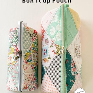 May include: Two quilted fabric pouches with zipper closures. The pouches are patchwork, featuring floral, gingham, and solid fabric pieces in various colors. The larger pouch has a mint green zipper and trim. Text on the image reads "Box It Up Pouch" and "Minki Kim".