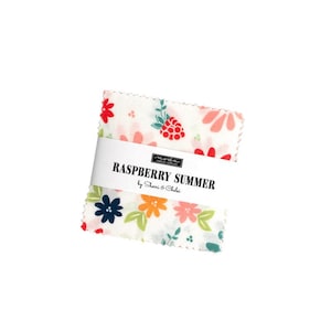 May include: A white fabric square with a floral pattern in shades of pink, red, yellow, green, and blue. The fabric features a raspberry design and the text "Raspberry Summer by Sherri & Chelsi".
