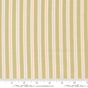 May include: A fabric swatch featuring a repeating vertical striped pattern in sage green, soft pink, and white. A white ruler is visible at the bottom edge, showing a scale of 7 inches, with the text moda and www.modafabrics.com printed below.