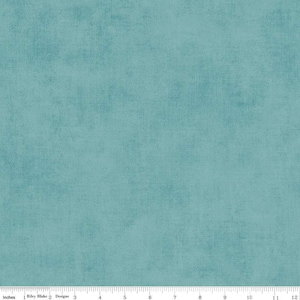May include: A solid teal blue fabric with a subtle textured pattern. The fabric has a slightly distressed look, giving it a vintage feel.
