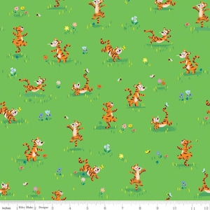 May include: A green fabric with a repeating pattern of orange and black tigers in various poses. The tigers are on a green background with small yellow flowers and butterflies.