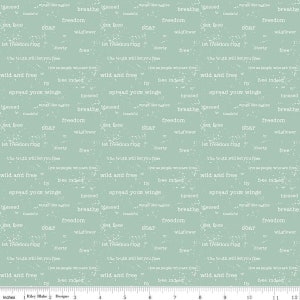 May include: A light blue fabric with a white repeating pattern of inspirational words and phrases. The words include "blessed", "wings like eagles", "breathe", "freedom", "set free", "soar", "wildflower", "let freedom ring", "liberty", "the truth will set you free", "live as people who are free", "free indeed", "wild and free", "fly", "spread your wings", "thankful".