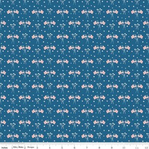 May include: A repeating pattern of American flags and white stars on a dark blue background. The flags are pink and white, and the stars are small and scattered. The fabric is likely suitable for patriotic-themed crafts or apparel.