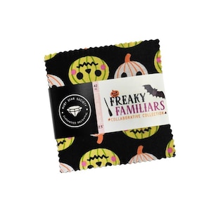 May include: A stack of 42 square fabric pieces with pinked edges, featuring a black background with yellow and white pumpkin illustrations. A white paper band wraps around the center, printed with the text Ruby Star Society Freaky Familiars.