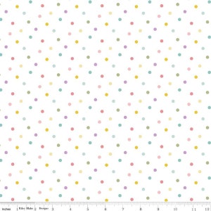 May include: White fabric with a repeating pattern of small, colorful polka dots. The dots are in shades of yellow, pink, green, blue, and purple.