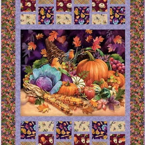 May include: A colorful autumn harvest scene with a cornucopia overflowing with pumpkins, gourds, corn, grapes, and a red cabbage. A small bluebird perches on a branch above the cornucopia. The scene is framed by a purple border with a repeating pattern of fall leaves and flowers.