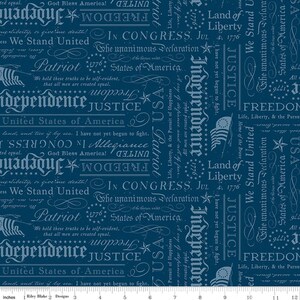May include: Dark blue fabric with a repeating pattern of patriotic text and imagery. The design includes words like "Freedom," "Justice," and "Independence," along with stars, flags, and the date 1776. The fabric is suitable for quilting and crafting.