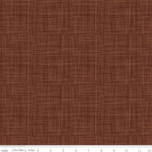 May include: A close-up of a brown fabric with a subtle woven pattern. The fabric has a slightly textured surface and a warm, earthy tone.