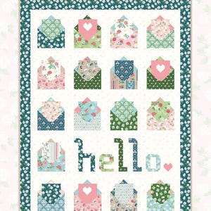 May include: A quilt pattern titled "Yours Truly" featuring a design of colorful envelopes with floral and heart motifs. The word "hello" is spelled out in green and blue letters. Quilt size is 60" x 80".