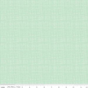 May include: A light green fabric with a subtle white grid pattern. The fabric has a textured, woven look.