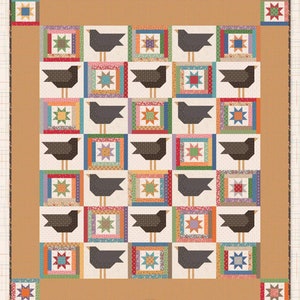 May include: A quilt pattern featuring a patchwork design of crows in a field of corn. The quilt is made up of squares with different colors and patterns, including red, blue, green, yellow, and brown. The quilt is titled "Crows in the Corn" and is designed by Lori Holt for Bee in my Bonnet Co.
