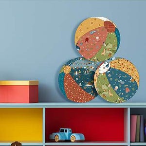 May include: Three colorful balloon covers with various patterns, including sea creatures and animals, are displayed. The text "BALLOON COVER" is at the top. The craft pattern has a finished size of 7 1/2" diameter.