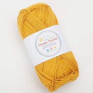 May include: A ball of yellow 100% cotton yarn labeled "Chunky Thread by Lori Holt of Bee in my Bonnet".