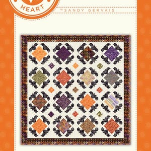 May include: A quilt pattern featuring a patchwork design with bats and a variety of colors, including orange, purple, black, and brown. The pattern is titled "In Flight" and is part of the "Pieces From My Heart" collection by Sandy Gervais.