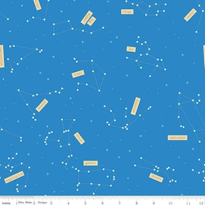 May include: A blue fabric with a white constellation pattern and the names of the constellations in beige text. The constellations include Aries, Taurus, Gemini, Cancer, Leo, Virgo, Libra, Scorpio, Sagittarius, Capricorn, Aquarius, Pisces, Orion, and Ophiuchus.