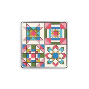 May include: A square enamel pin featuring a four-quadrant grid design. Each quadrant displays a distinct geometric pattern inspired by quilt blocks, utilizing a color palette of pink, olive green, mustard yellow, and light blue on a cream background.